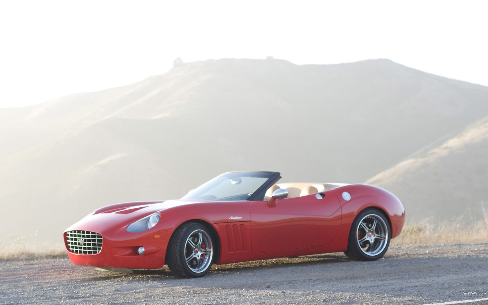 Красный AnterosXTM-Roadster на фоне гор Автомобили картинки, обои рабочий стол